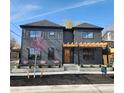 Contemporary two-story home featuring a modern design and a well-manicured yard at 3649 W 21St Ave, Denver, CO 80211