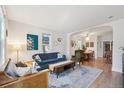 Bright living room with hardwood floors, big windows, comfortable seating and open floor plan at 422 Atwood St, Longmont, CO 80501