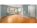 Bright living room featuring gleaming hardwood floors and ample natural light at 665 Washington St # 5B, Denver, CO 80203
