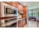 Updated kitchen boasts stainless steel appliances, modern cabinetry and adjacent built-in desk at 7462 S Quail Cir # 426, Littleton, CO 80127