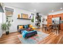 Bright living area with hardwood floors, plenty of natural light, and modern furnishings at 1106 Oak Cir, Lakewood, CO 80215