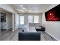 Comfortable living room with new floors, neutral paint, and ample natural light at 6500 E 88Th Ave # 258, Henderson, CO 80640