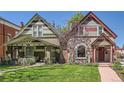 A charming home featuring a well-maintained lawn and inviting curb appeal near another home on the street at 3047 Osceola St, Denver, CO 80212