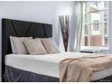 Bedroom with comfortable bedding, natural lighting, and a cozy atmosphere to relax and unwind at 2281 Vaughn # 104A, Aurora, CO 80014