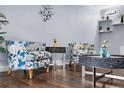 Inviting living room with hardwood floors, stylish decor, and comfortable seating at 2281 Vaughn # 104A, Aurora, CO 80014