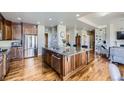 Spacious kitchen featuring a large island, stainless steel appliances, and hardwood floors at 22475 E Hidden Trail Dr, Parker, CO 80138