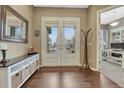 Welcoming foyer with hardwood floors, a double door entrance and ample space at 2618 Bellavista St, Castle Rock, CO 80109