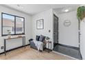 Inviting entryway with a sleek black door, ample natural light, and modern accents at 6680 E Mississippi Ave # 3, Denver, CO 80224