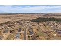 Stunning aerial view showcasing the beautiful community with mountain views in the background at 7635 Weaver Cir, Castle Rock, CO 80104
