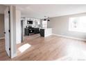 Open-concept kitchen with stainless steel appliances and a central island perfect for entertaining at 1568 Verbena St, Denver, CO 80220