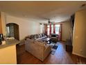 Spacious living room featuring hardwood floors and a cozy seating arrangement at 14201 E 1St Dr # 104, Aurora, CO 80011