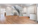 Open living area with hardwood floors and staircase at 63 Harrison St, Denver, CO 80206