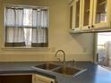 Functional kitchen featuring a stainless steel double sink with a window at 1339 Sumner St # B, Longmont, CO 80501