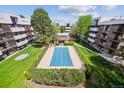 Apartment building with a pool in the courtyard at 384 S Ironton St # 413, Aurora, CO 80012