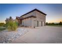 Modern home featuring a three-car garage and tasteful landscaping at 17635 Silver Fox Ct, Mead, CO 80542