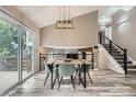Bright dining room featuring hardwood floors, with backyard access at 11481 King St, Westminster, CO 80031
