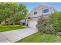 Charming two-story home featuring stone accents, a two-car garage, and a well-maintained front yard at 11481 King St, Westminster, CO 80031