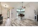 Bright living room featuring vaulted ceilings, hardwood floors, and large windows for natural light at 11481 King St, Westminster, CO 80031
