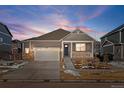 Attractive ranch home with stone accents, a covered porch, and a two-car garage at 39 N Waterloo St, Aurora, CO 80018