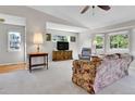 Bright living room featuring large windows, comfortable seating, and neutral decor at 9177 W Cedar Dr # D, Lakewood, CO 80226