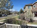 Beautiful street view showcases well-maintained landscaping and neighborhood charm at 16022 W 63Rd Ln # A, Arvada, CO 80403