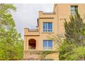 Close-up exterior showcasing architectural details, balconies, and lush greenery at 2500 E Cherry Creek South Dr # 306, Denver, CO 80209
