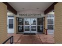 Well-lit entrance to the building with double doors and a covered entryway at 9300 E Center Ave # 2B, Denver, CO 80247