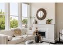 Bright living room with large windows, modern decor and comfortable seating at 1932 W 32Nd Ave, Denver, CO 80211