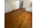 Open living room with hardwood floors and access to the staircase at 1533 S Jamaica St, Aurora, CO 80012
