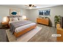 Virtually staged main bedroom with light wood furniture and new carpet at 1772 Robb St, Lakewood, CO 80215