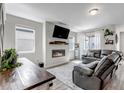 Inviting living room with a cozy fireplace and modern decor at 3953 John Ave, Castle Rock, CO 80104