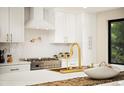 Modern kitchen featuring white cabinetry, stainless steel appliances, and a stylish gold faucet at 4656 Tanglewood Trl, Boulder, CO 80301
