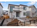 Charming two-story home showcasing modern design elements and well-maintained landscaping at 3336 N Haleyville Ct, Aurora, CO 80019
