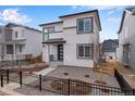 Charming two-story home showcasing modern design elements and well-maintained landscaping at 3336 N Haleyville Ct, Aurora, CO 80019