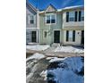 Exterior view of a townhome in a snow-covered neighborhood at 1641 S Idalia Cir # F, Aurora, CO 80017