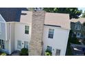 An aerial view showing the roof and facade of this cozy townhome at 8960 W Dartmouth Pl, Lakewood, CO 80227