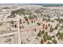 Expansive aerial view of the property's acreage, showcasing the surrounding landscape and neighborhood at 512 County Road 136, Elizabeth, CO 80107