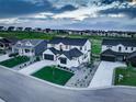 An aerial view of a white modern farmhouse showing its location in a picturesque neighborhood at 39405 Stockton Cir, Elizabeth, CO 80107