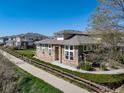 Charming exterior of home with stone accents, manicured landscaping, and inviting curb appeal at 3000 E 112Th Ave # 56, Northglenn, CO 80233