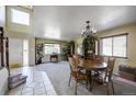 Inviting living area with tiled entry, lots of natural light, and a dining area at 4863 Quail Ct, Frederick, CO 80504