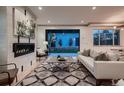 Bright living room with a fireplace and sliding glass doors leading to the backyard at 291 S Franklin St, Denver, CO 80209