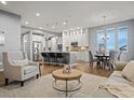 Spacious open-concept living area with a modern kitchen and stylish dining space at 2351 Lassen Ln, Castle Rock, CO 80109