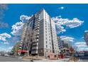 Condominium building exterior showcasing modern design, balconies, and beautiful landscaping at 2 Adams St # 905, Denver, CO 80206