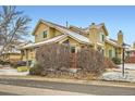 Side view of townhome shows well-kept landscape, brick detail, and cozy surroundings at 2146 S Scranton Way, Aurora, CO 80014