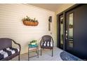 Inviting front porch with wicker chairs, perfect for relaxing at 6324 S Grape Ct, Centennial, CO 80121