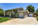 Beautiful home featuring siding, well-maintained yard, and driveway to attached garage at 1576 S Ursula Ct, Aurora, CO 80012