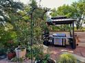 Outdoor kitchen area with built-in grill at 4696 S Yates St, Denver, CO 80236