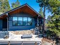 Home featuring an inviting outdoor fire pit area and breathtaking mountain views at 22598 Westview Ave, Golden, CO 80401