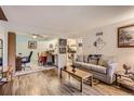 Inviting living room with hard surface floors and neutral color scheme at 3141 S Tamarac Dr # 110G, Denver, CO 80231