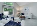 Comfortable living room with ample natural light and neutral decor at 10966 W Half Moon Pass, Littleton, CO 80127